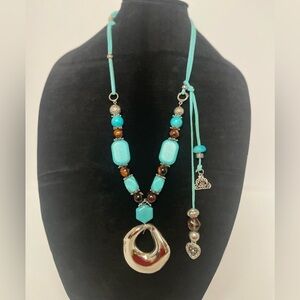 Leather and faux turquoise necklace duo, one gold, one silver.